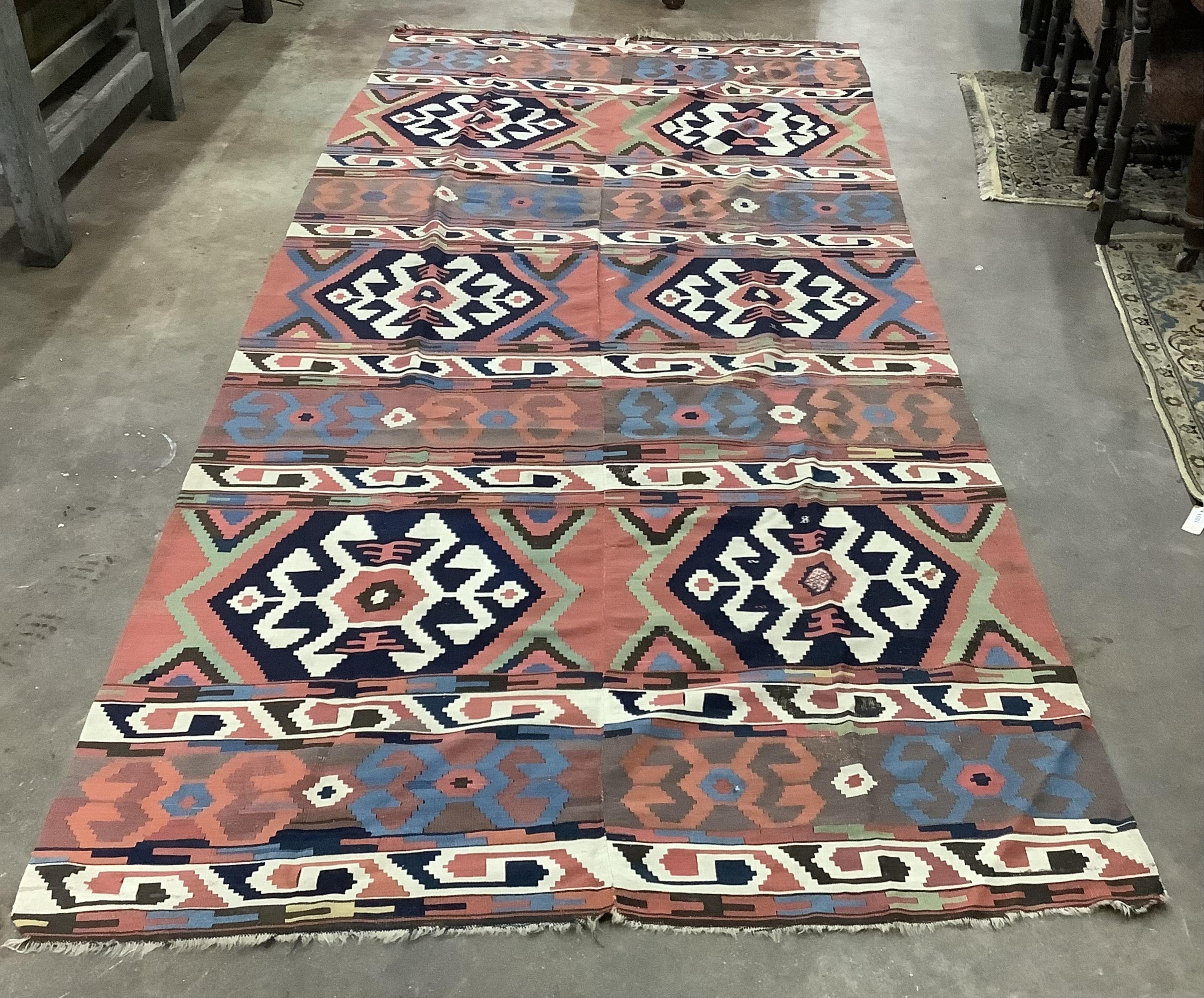 A large Kilim wall-hanging / rug 390cm x 173cm. Condition - fair